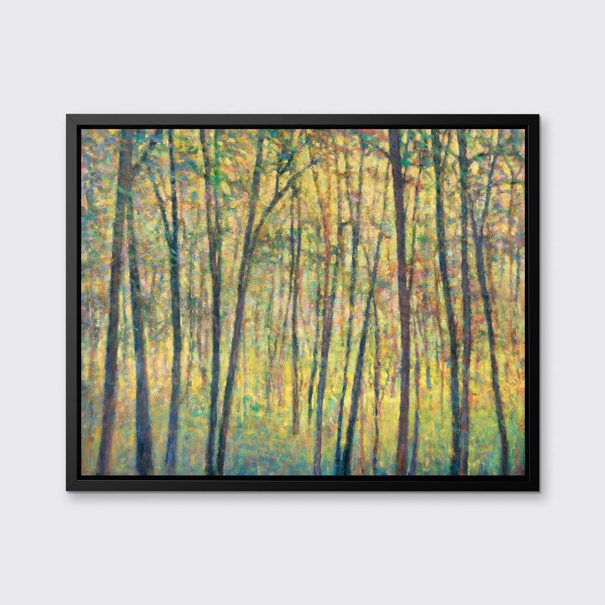 A yellow, brown and green abstract tree landscape print in a black floater frame hangs on a white wall.