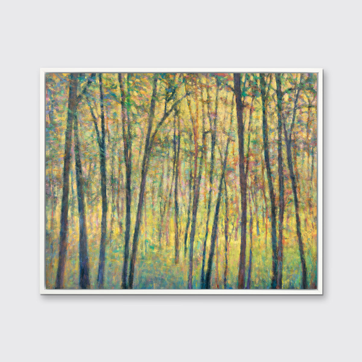 A yellow, brown and green abstract tree landscape print in a white floater frame hangs on a white wall.