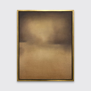 A brown and gold abstract print in a gold floater frame hangs on a white wall.