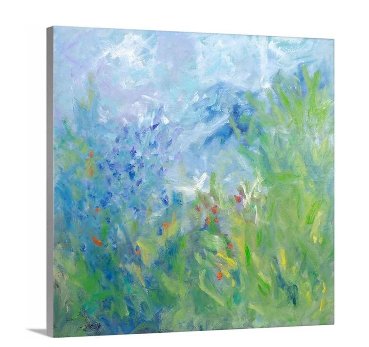 A side-angle view of a blue, green, yellow and white abstract floral print on canvas.