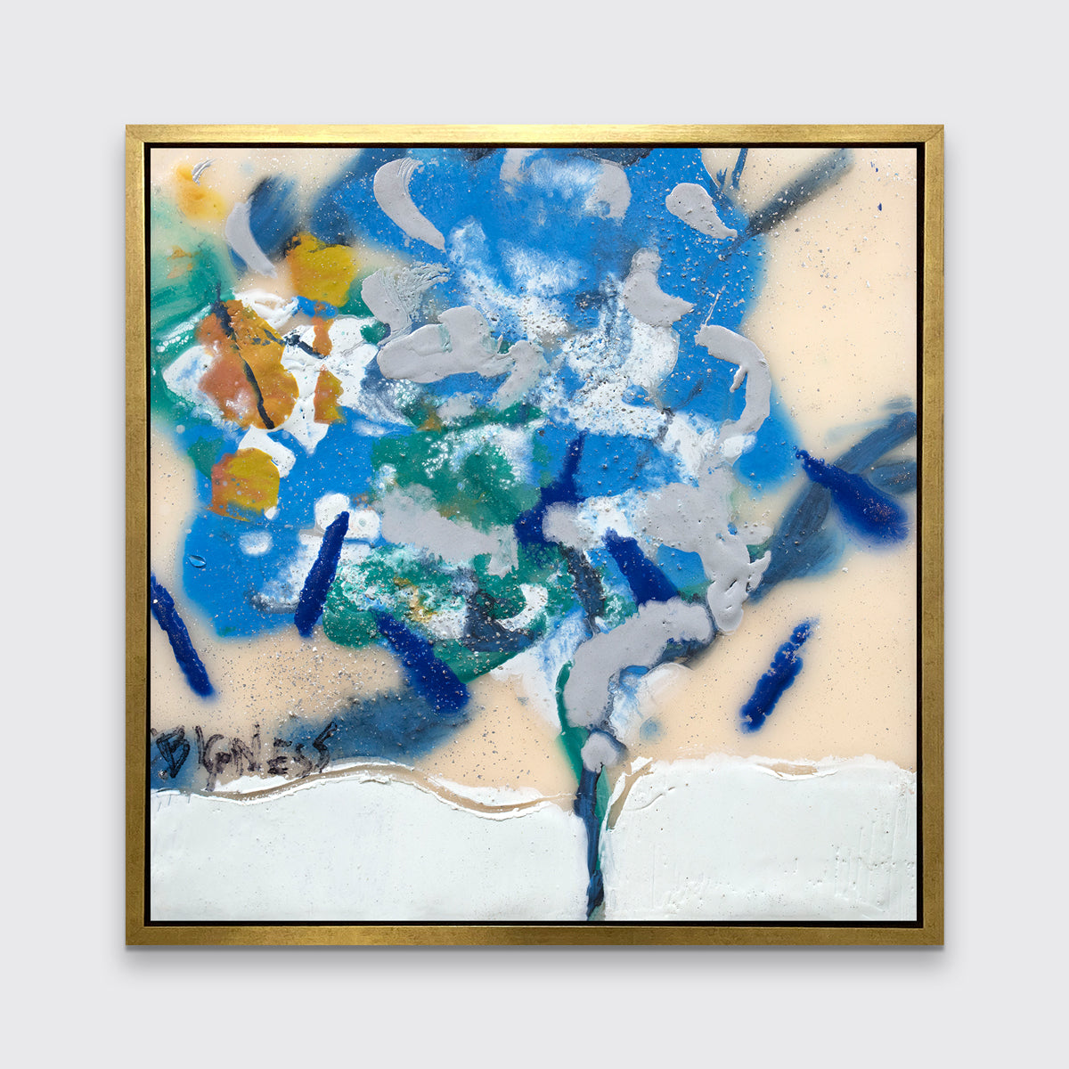 A blue, white, green and orange abstract print in a gold floater frame hangs on a white wall.