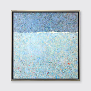 A blue abstract landscape in a silver floater frame hangs on a white wall.