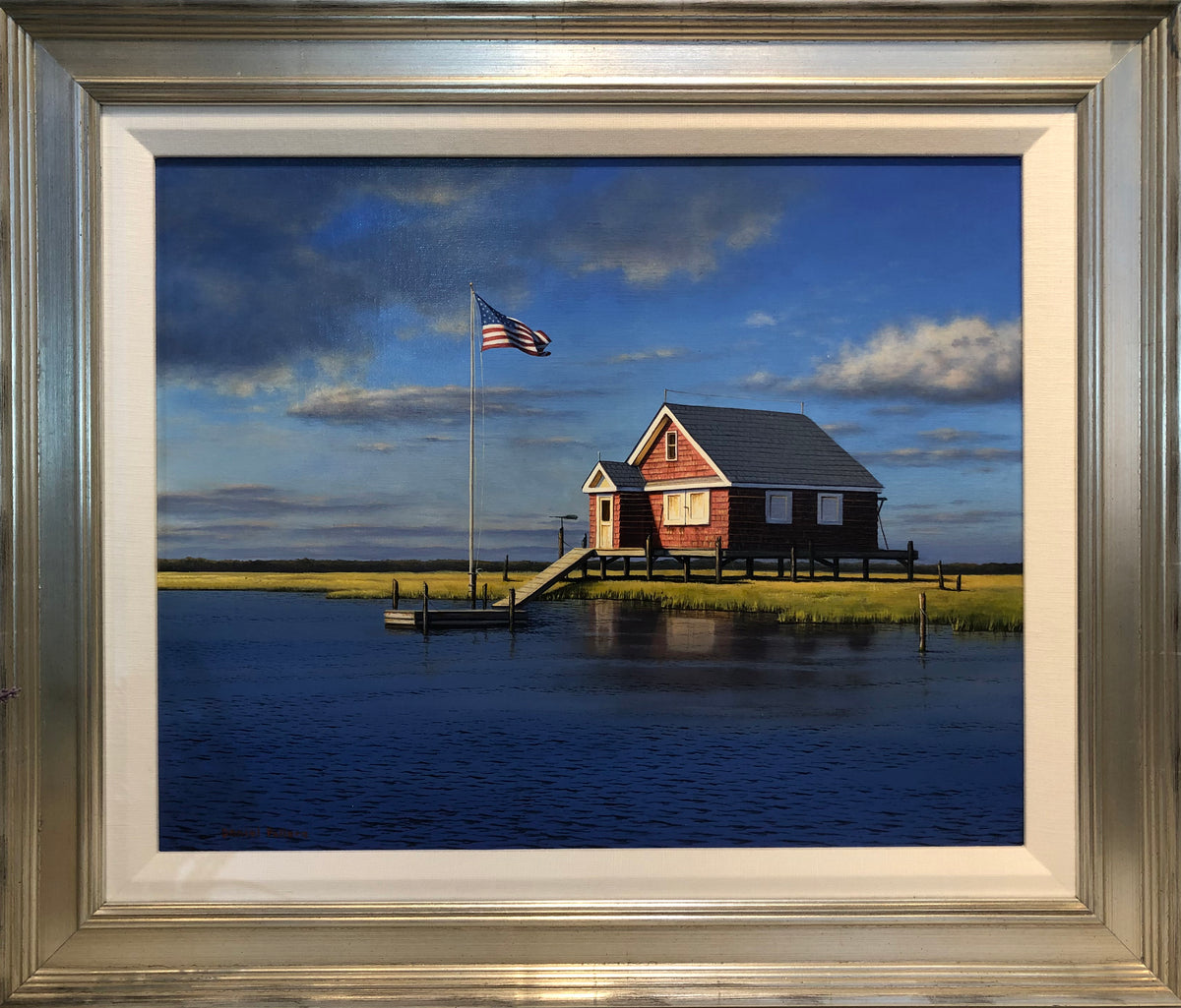 "Seaman Bay House" in a silver frame. 