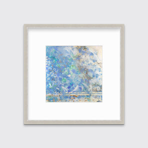 A lavender, blue and cream abstract print in a silver frame with a mat hangs on a white wall.