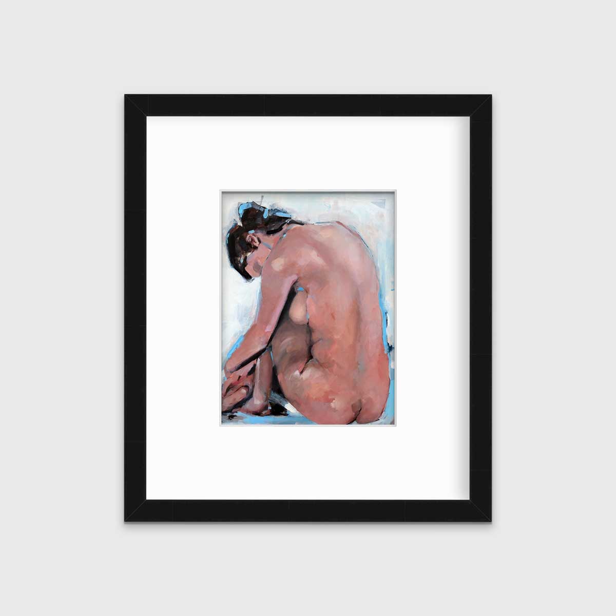 A contemporary seated figure facing away in a black frame with a mat hangs on a white wall.