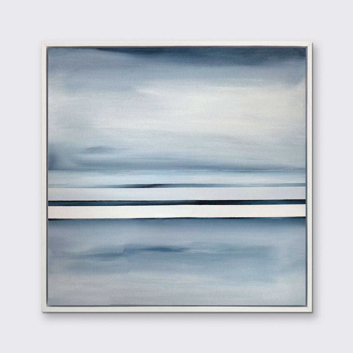 A blue and white linear abstract landscape print in a white floater frame on a wall.