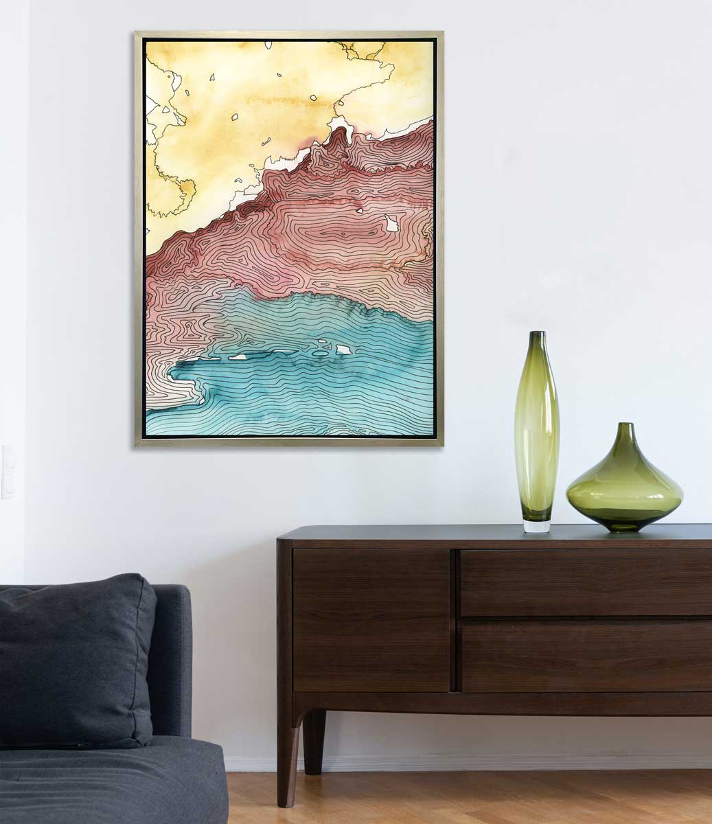 A yellow, dark red, teal and black abstract landscape print in a silver floater frame hangs on a white wall above a dark wood credenza with two different green vases and next to a dark blue sofa.