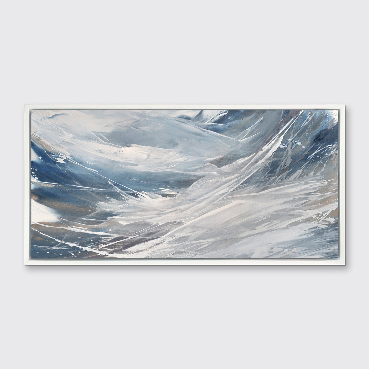 A grey, white and blue abstract print in a white floater frame hangs on a white wall.