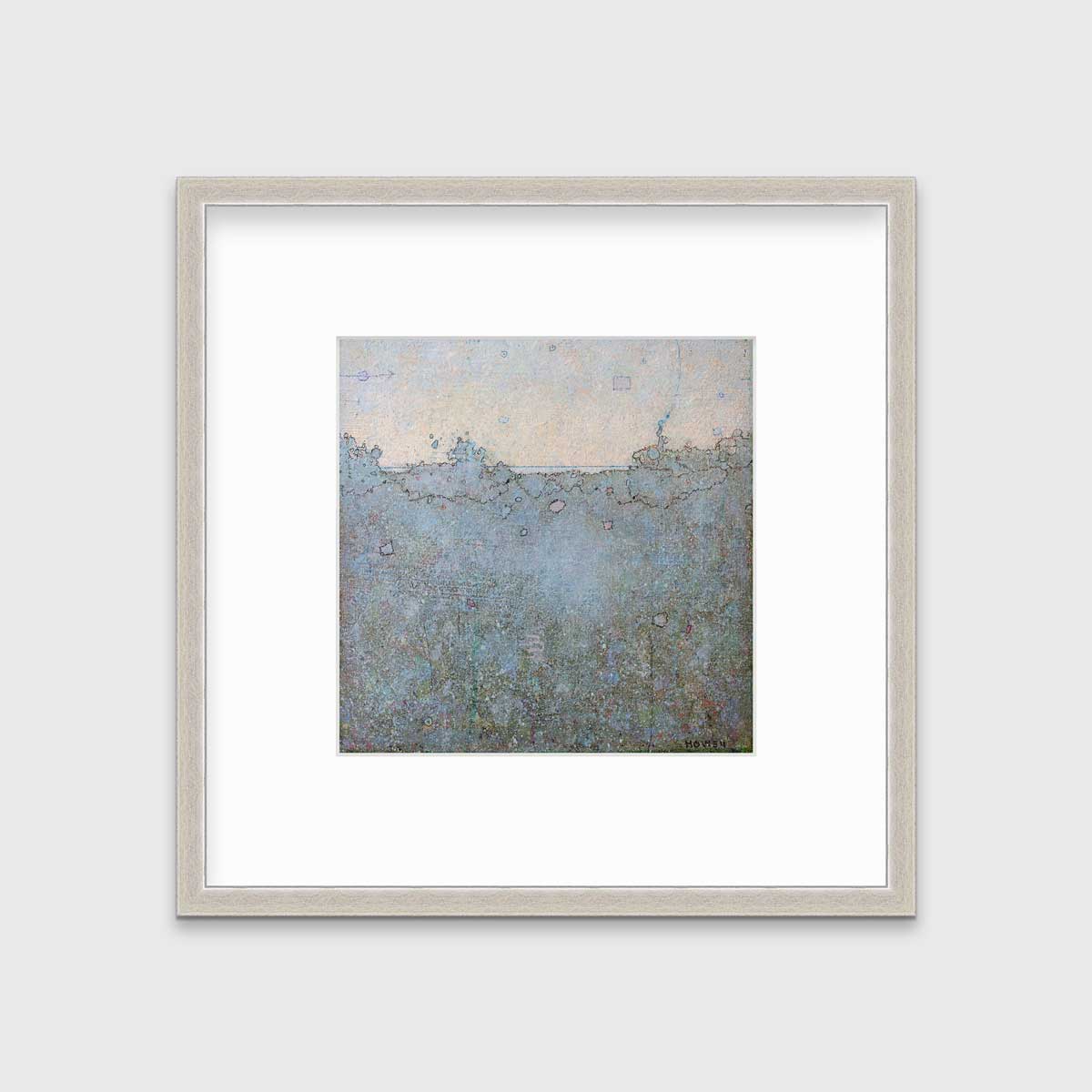 A dark abstract landscape print in a silver frame with a mat hangs on a white wall.
