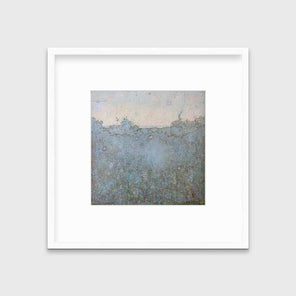 A dark abstract landscape print in a white frame with a mat hangs on a white wall.