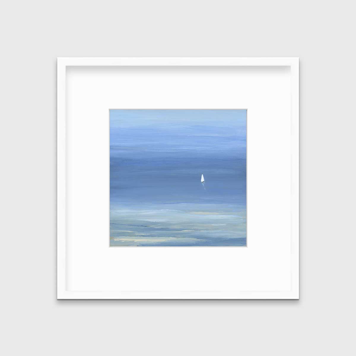 A blue, light green and white abstract seascape print with a small sailboat in a white frame with a mat hangs on a white wall.