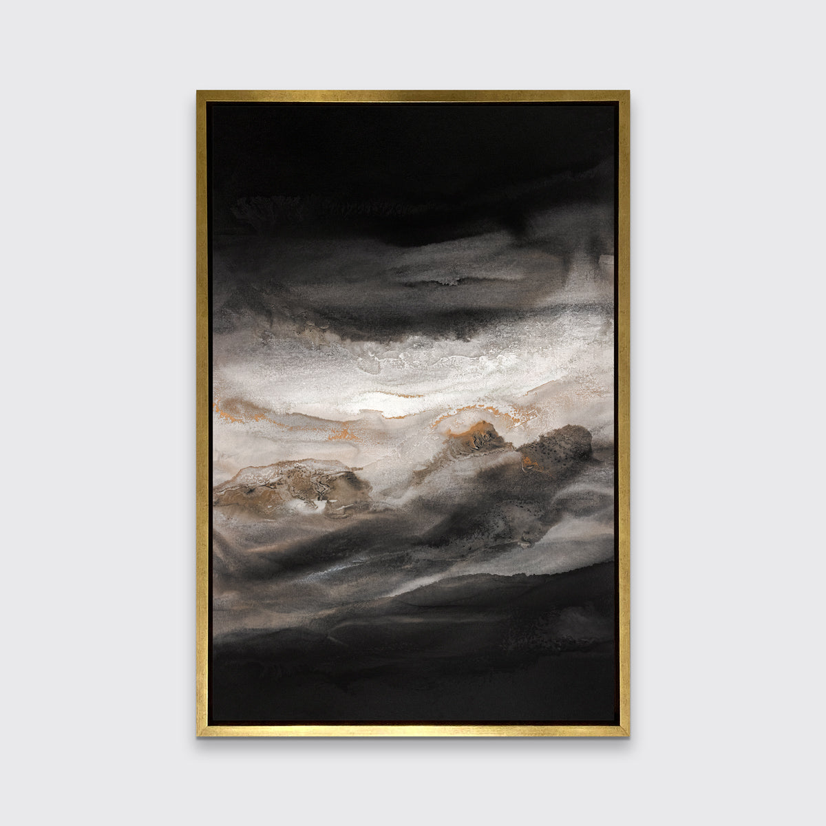 A black, white, beige and gold abstract print in a gold floater frame hangs on a white wall.