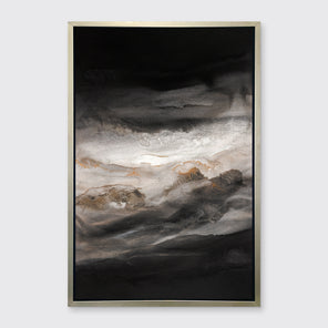 A black, white, beige and gold abstract print in a silver floater frame hangs on a white wall.