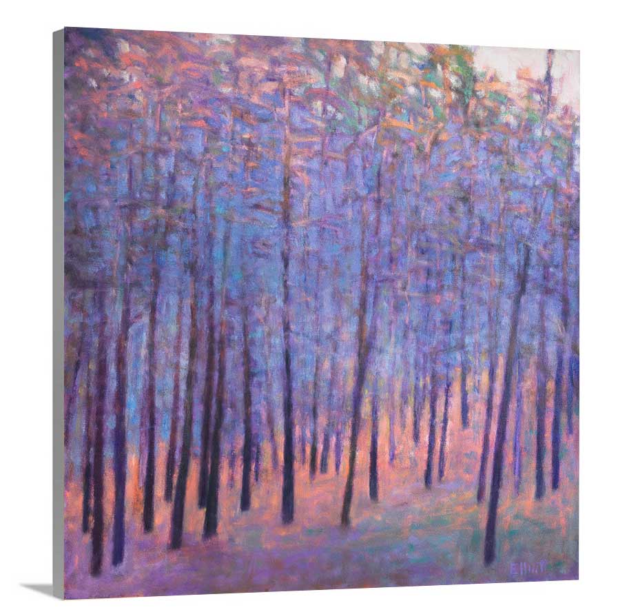 A side-angle view of a blue and pink abstract tree landscape print on canvas.