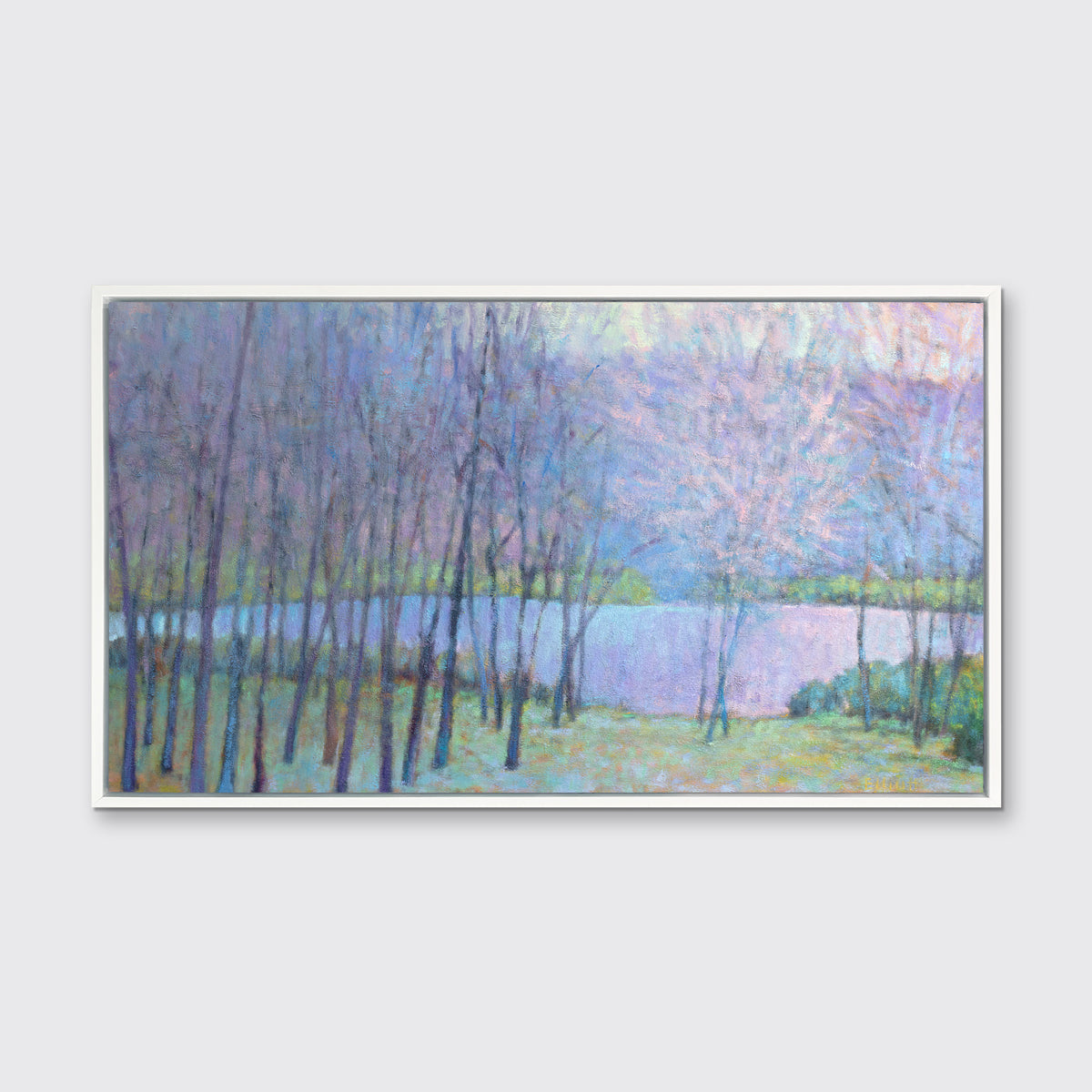 A blue, purple and green abstract landscape print in a white floater frame hangs on a white wall.