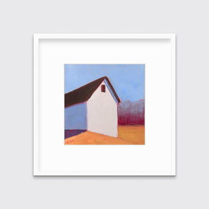 A blue, white, red and orange contemporary barn print in a white frame with a mat hangs on a white wall.