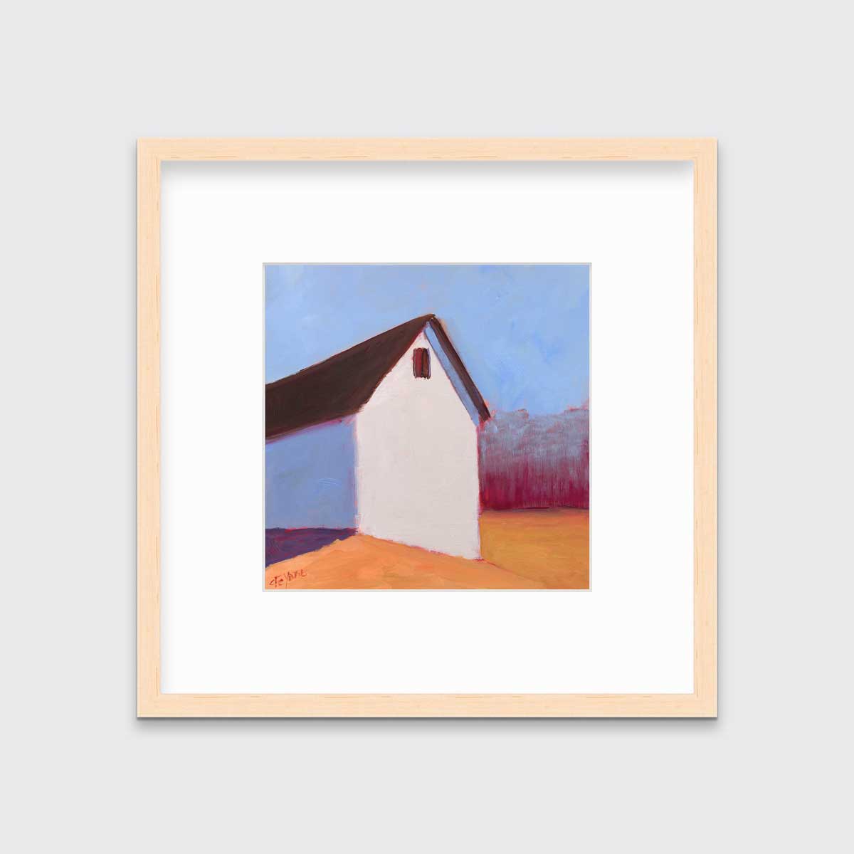 A blue, white, red and orange contemporary barn print in a natural wood frame with a mat hangs on a white wall.