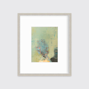 A light green, beige, light blue and black abstract figural print in a silver frame with a mat hangs on a white wall.
