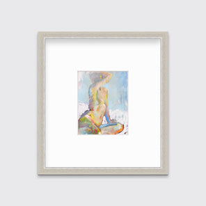 A multicolored abstract figural print in a silver frame with a mat hangs on a white wall.