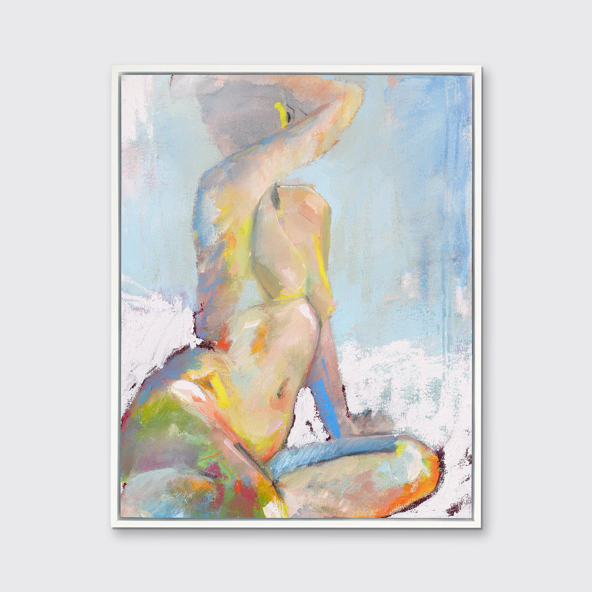 A multicolored abstract figural print in a white floater frame hangs on a white wall.