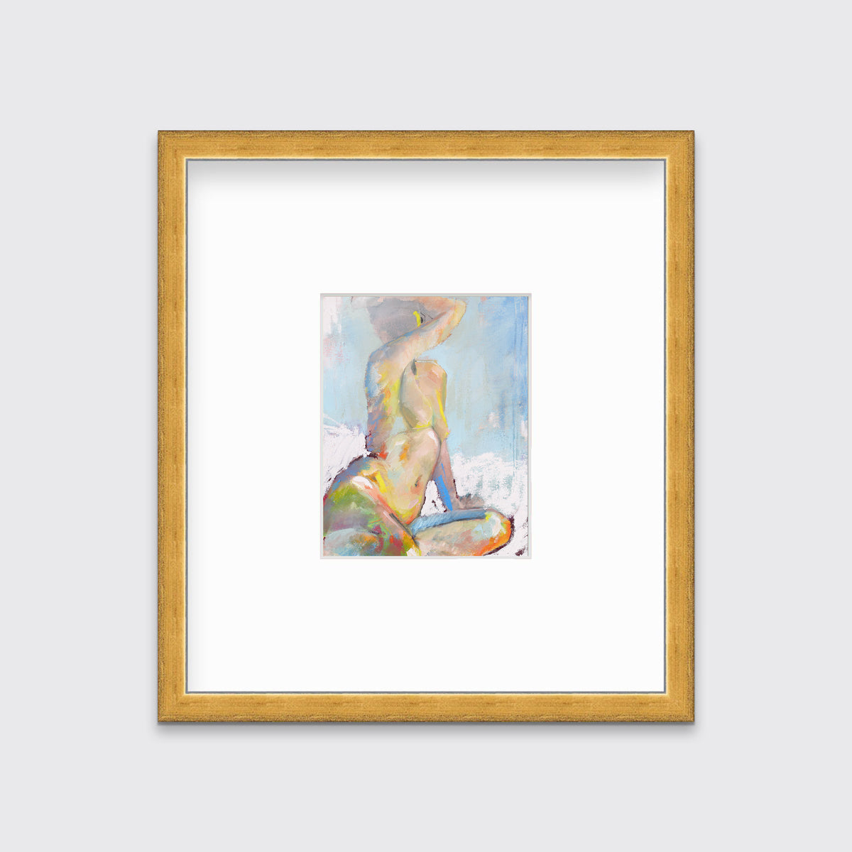 A multicolored abstract figural print in a gold frame with a mat hangs on a white wall.