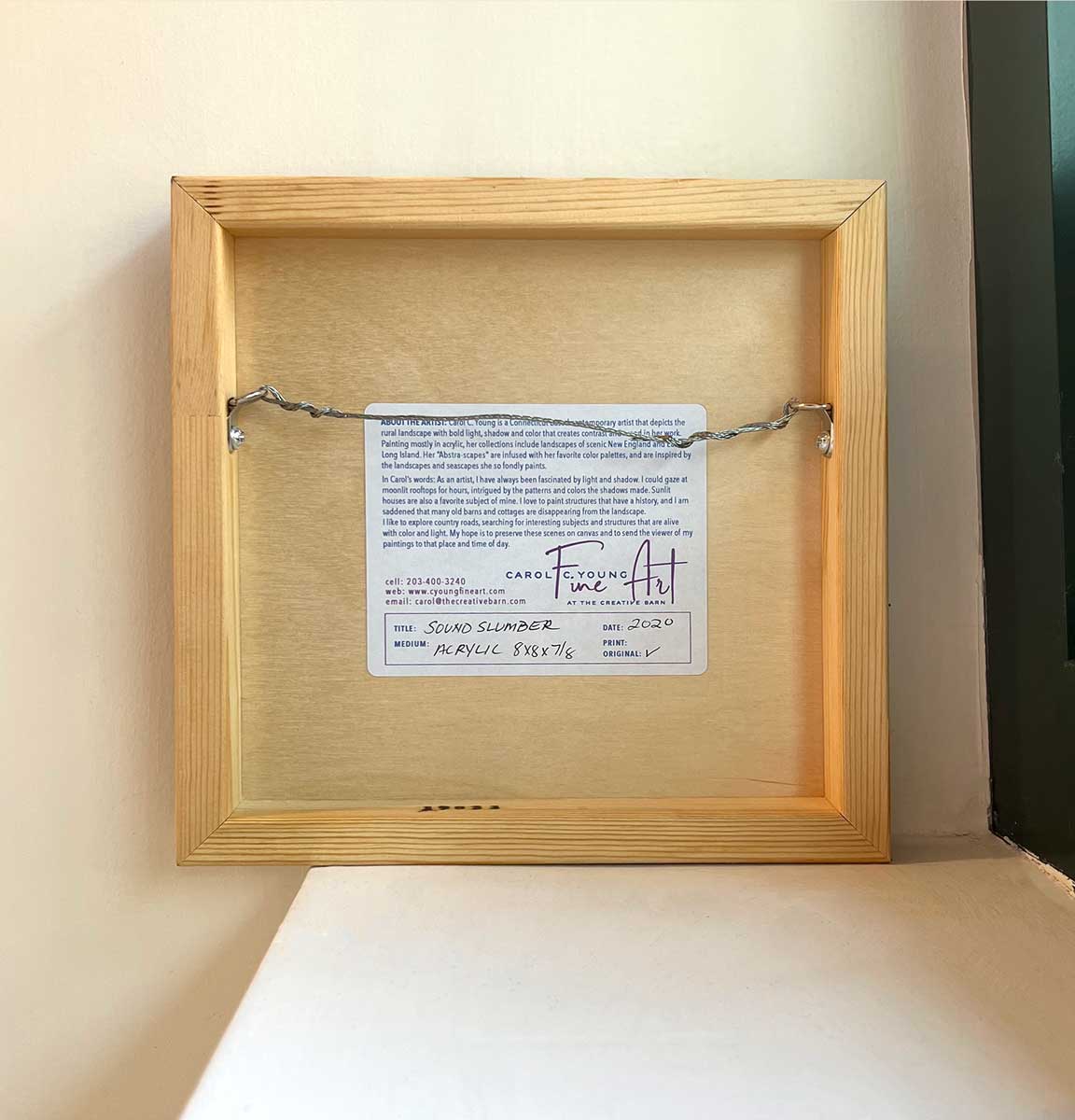 The back of the painting stickered with its authentication and artist's signature.
