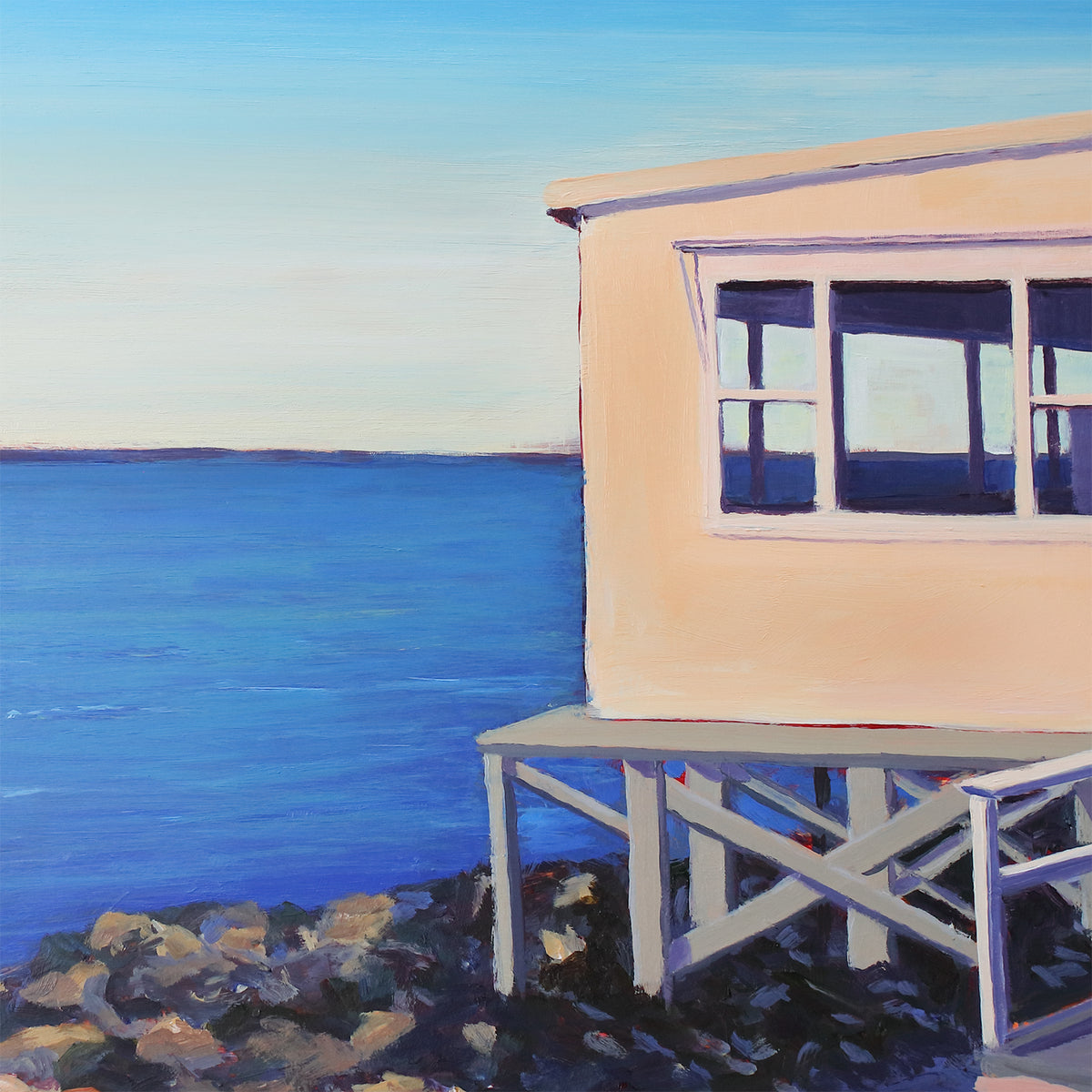 A detail shot of a painting of a house on the water.