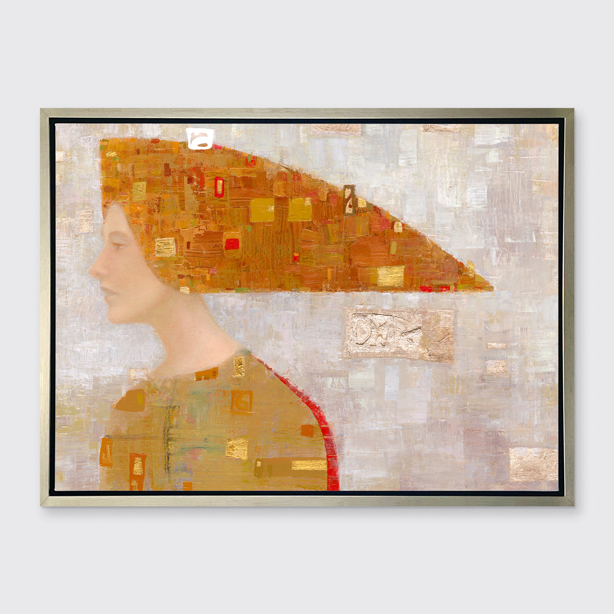 A print of an abstract portrait of a woman in profile wearing a long orange and gold, triangular head piece in a silver floater frame hangs on a white wall.
