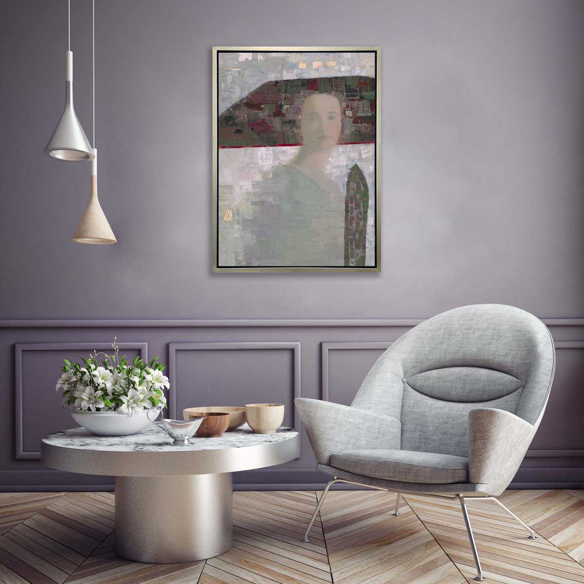 A grey and purple abstract of a woman with a large headpiece print in a silver floater frame hangs on a light purple wall above a grey modern chair, a short round silver table and a bowl of white lillies.