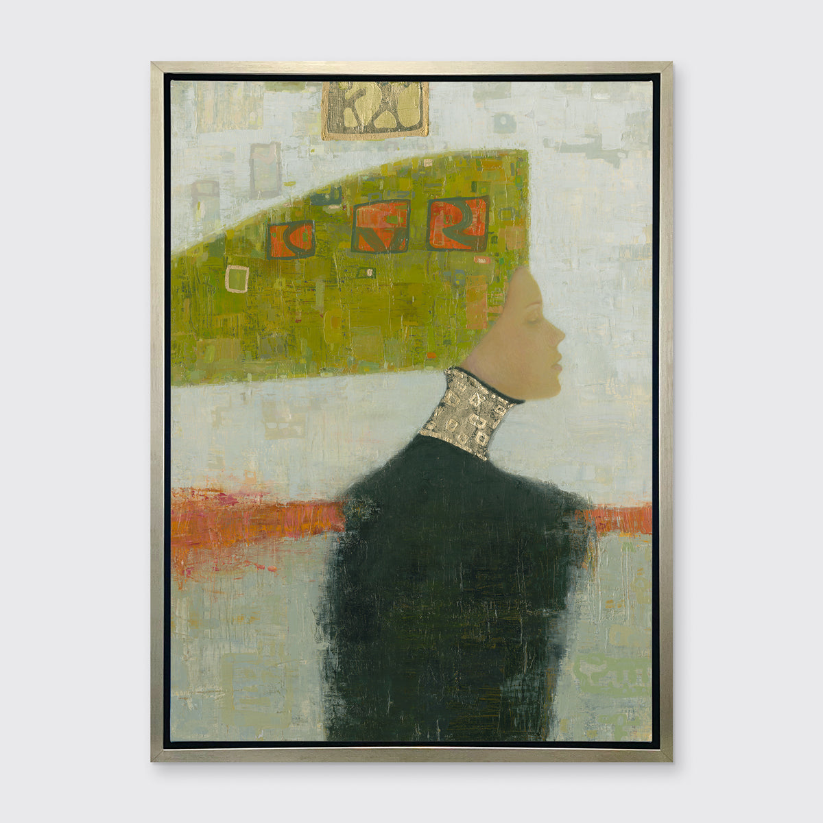A grey, green and orange abstract print of a woman with a headpiece in a silver floater frame hangs on a white wall.