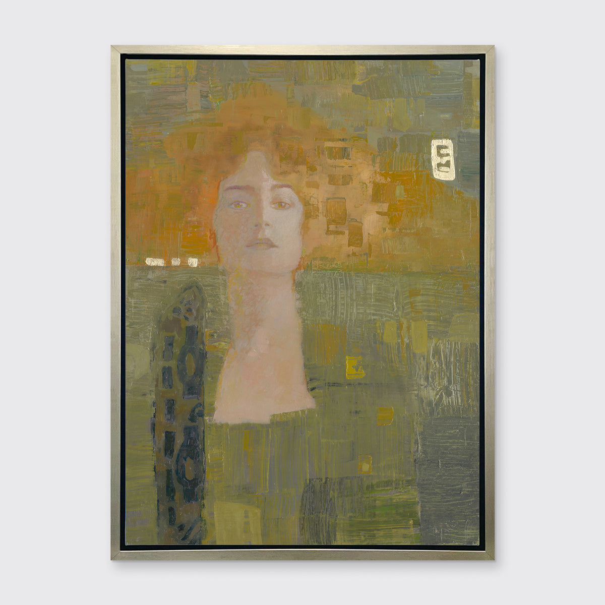 A orange and olive green abstract print of a woman in a silver floater frame hangs on a white wall.