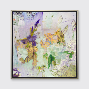 A purple, gold, blue and green abstract print in a silver floater frame hangs on a white wall.