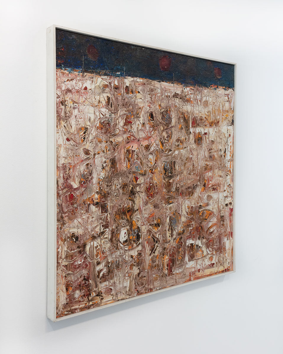 An abstract expressionist painting with a textured surface is viewed at an angle. Its textured surface is from the artist scraping the paint with a palette knife, exposing its under layer. The painting is in a white frame.
