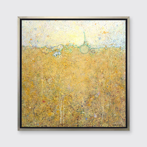 A dark yellow abstract landscape by Elwood Howell in a silver floater frame hangs on a white wall.