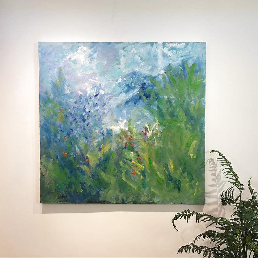 Abstract floral painting of a natural scene with blue, green, and red colors on a white wall.