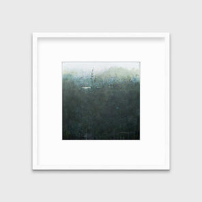 A dark muted teal abstract landscape print in a white frame with a mat hangs on a white wall.