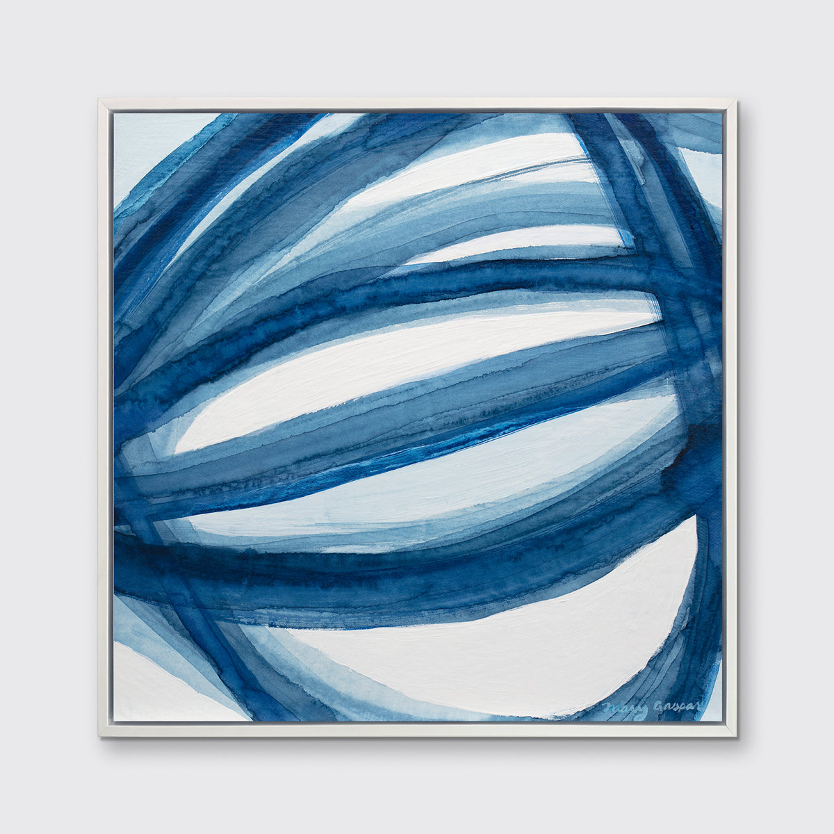 A blue and white abstract print in a white floater frame hangs on a white wall.