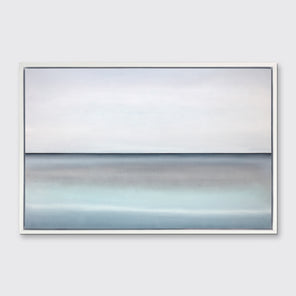 A tonal blue abstract landscape with a defined horizon print in a white floater frame hangs on a white wall.
