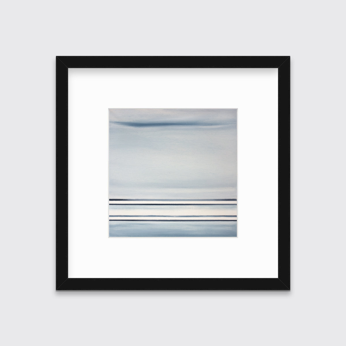 A blue and white linear abstract print in a black frame with a mat on a white wall.