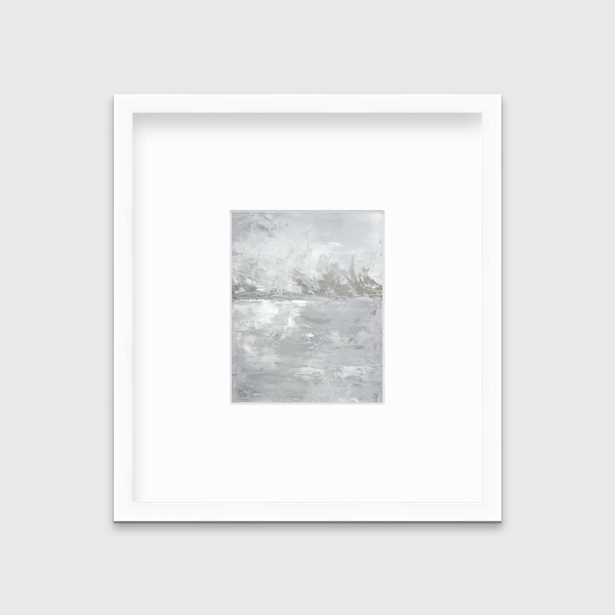 A white and grey abstract print in a white frame with a mat hangs on a white wall.