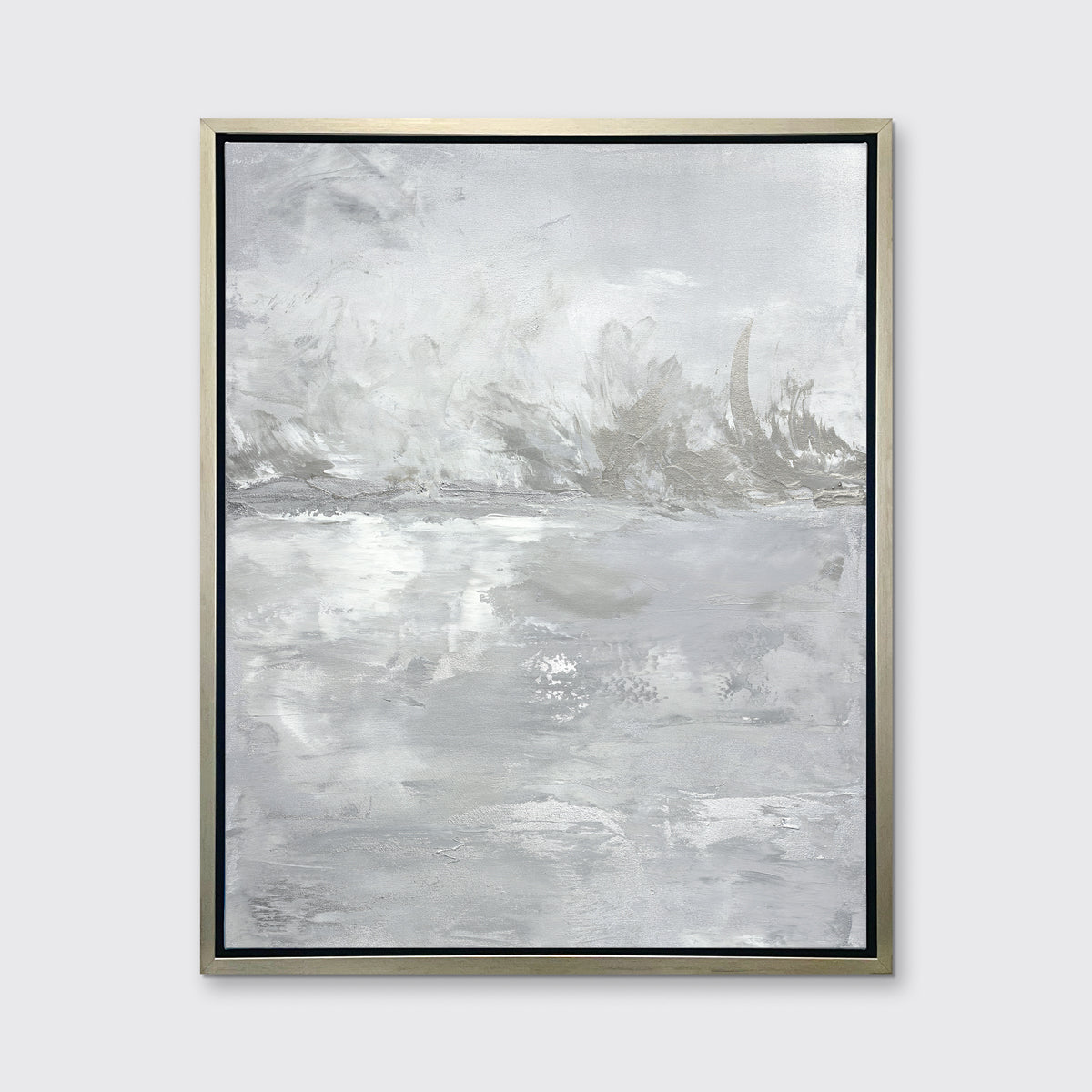 A grey abstract print by Julia Contacessi in a silver floater frame hangs on a white wall.