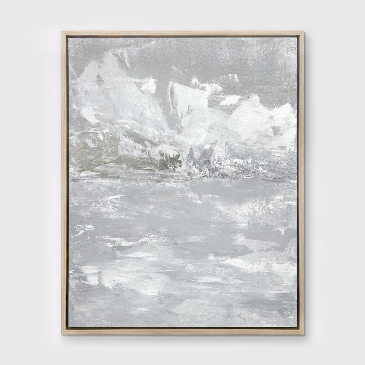 A white and grey abstract print in a white oak wood floater frame hangs on a white wall.