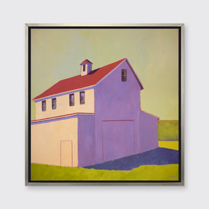 A lavender, green, beige and red contemporary barn print in a silver floater frame hangs on a white wall.