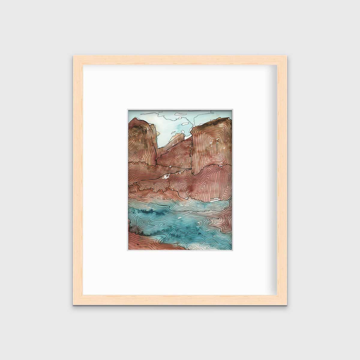A teal, brown and black abstract landscape print in a natural wood frame with a mat hangs on a white wall.
