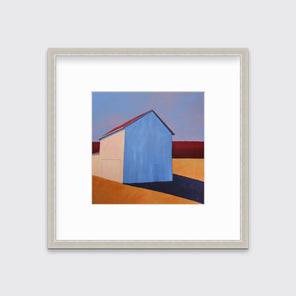 A lavender, red, beige and orange contemporary barn print in a silver frame with a mat hangs on a white wall.