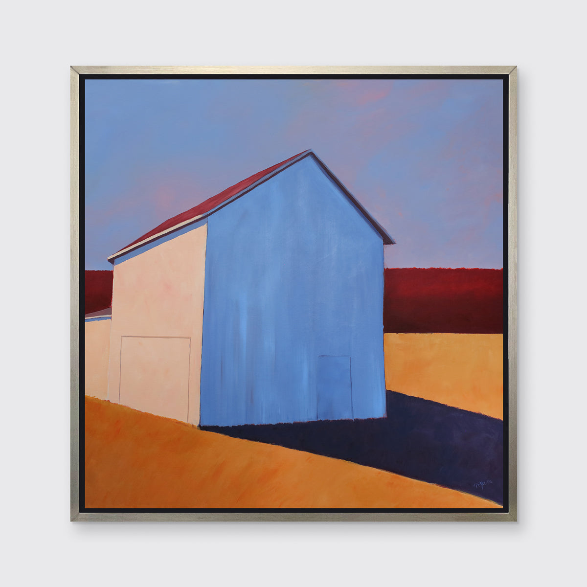 A lavender, red, beige and orange contemporary barn print in a silver floater frame hangs on a white wall.