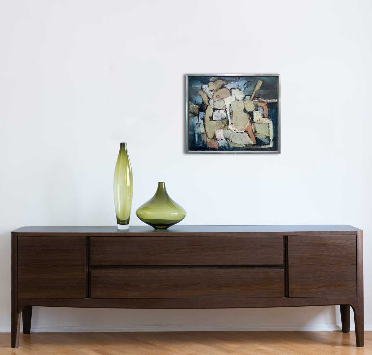 A painting of abstract human forms hangs above a console table.