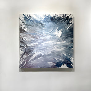A white, blue, and lavender abstract painting by Teodora Guererra hangs on a white wall. 