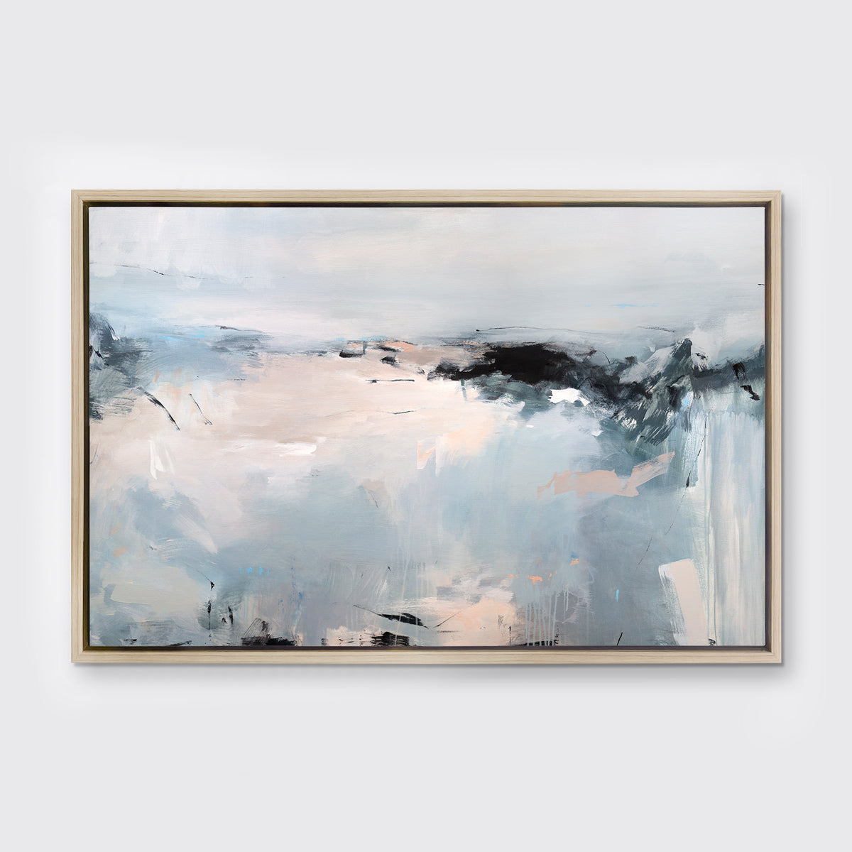 A light blue, white, light pink and black abstract print in a white oak wood floater frame hangs on a white wall.