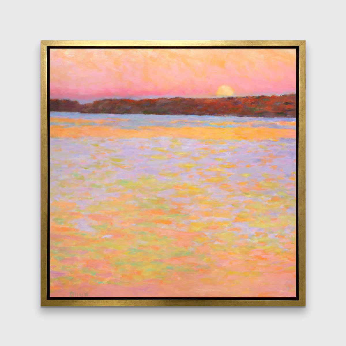 A pink, orange, lavender and red impressionist landscape print in a gold floater frame hangs on a white wall.
